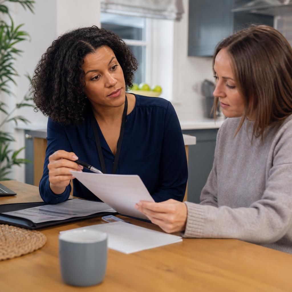 Foster carer reviewing placement information with a social worker