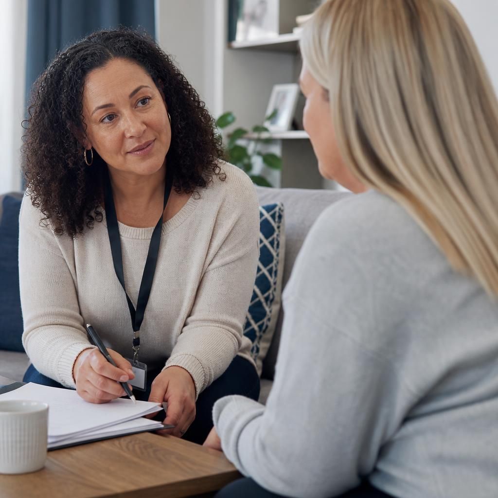 Foster carer speaking with a supervising social worker about a child’s care plan