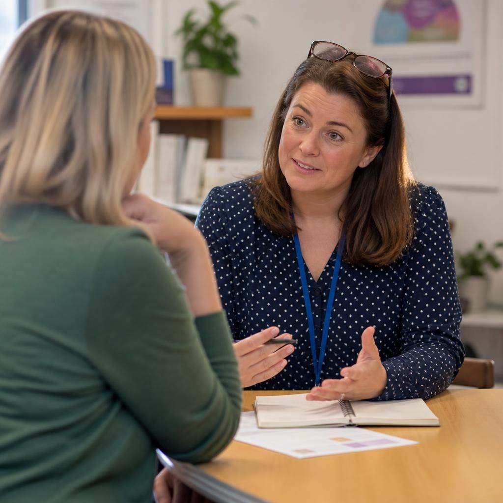 Foster carer discussing guidance with a support adviser